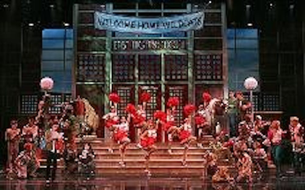 STICK TO THE STATUS QUO - Upbeat songs and acrobatic choreography bring the charm of the famous Disney made-for-TV movie to the stage. Popular songs like "Stick to the Status Quo" and "We're All In This Together" made the National Theater audience groove.
