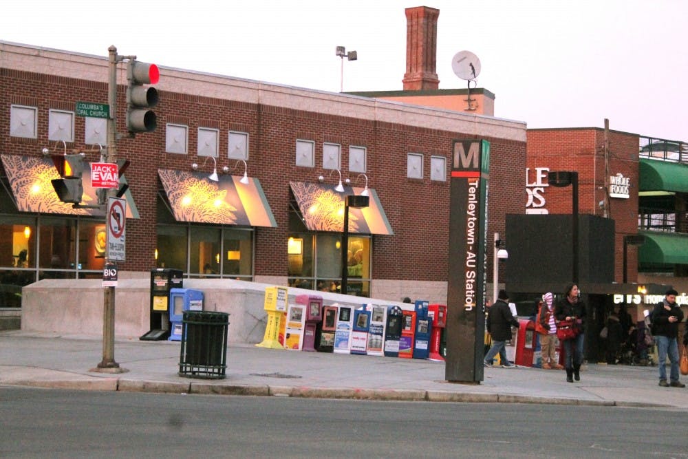 People stand near the Tenleytown Metro stop in 2014.