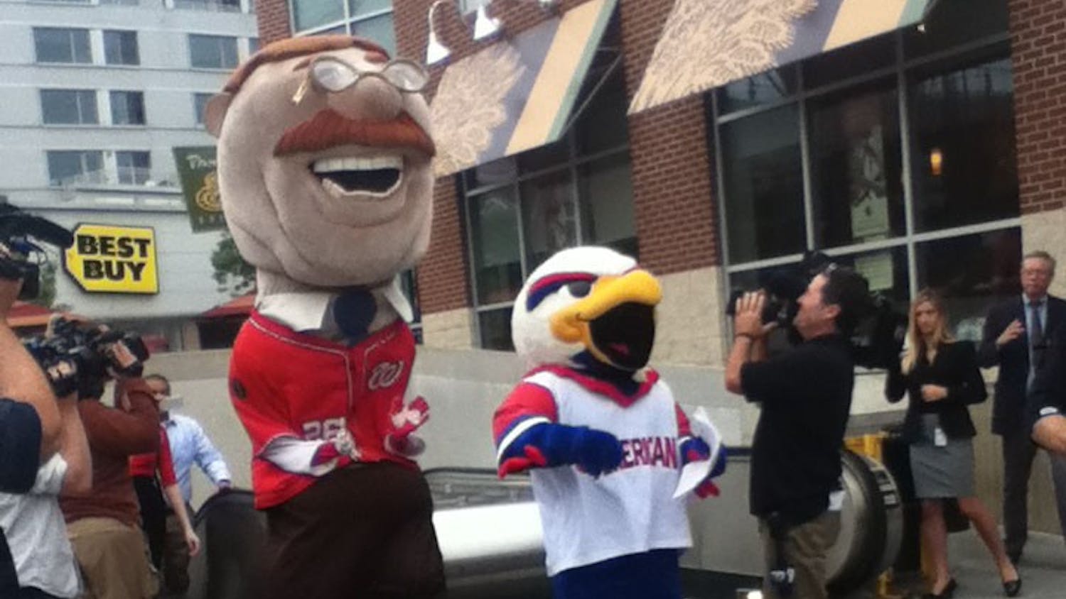 	The Nationals&#8217; mascot Teddy Roosevelt and Clawed Z Eagle outside of the Tenleytown metro station.
