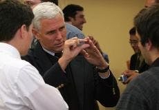 TALKING POINTS - Rep. Mike Pence, R-Ind., talks with Michael Monrroy (left) and Ajay Bruno (right) before speaking at an event sponsored by the AU College Republicans Tuesday night in Mary Graydon Center. During his speech, Pence said the Republican Party