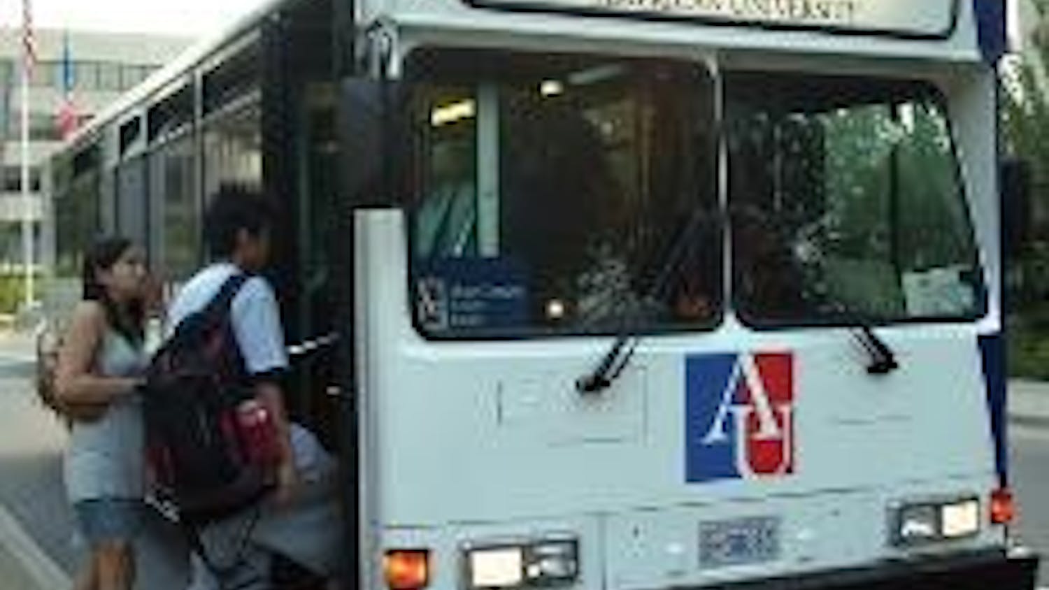 TO TENLEY - Students board the AU shuttle at the North side stop to Tenleytown. The shuttle drivers are currently attempting to unionize.