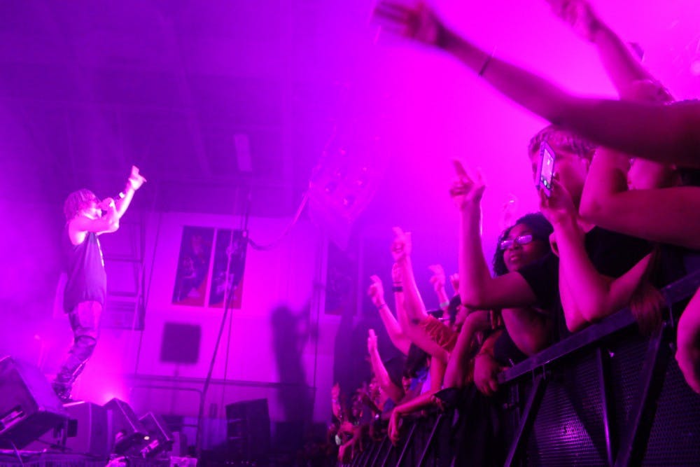 Lupe Fiasco plays for a crowd of AU students in Bender Arena on Aug. 24, 2013, a Welcome Week concert hosted by the Student Union Board.