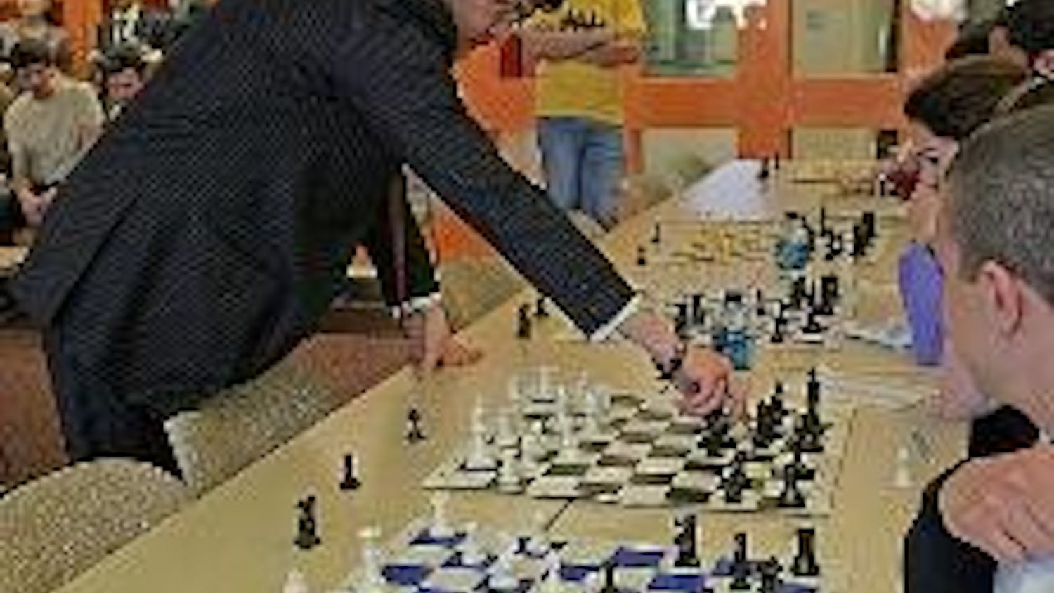 CHECK MATE - International Chess Grandmaster Darmen Sadvakasov plays 20 members of AU's chess club simultaneously. He won 19 of the games and tied one. 