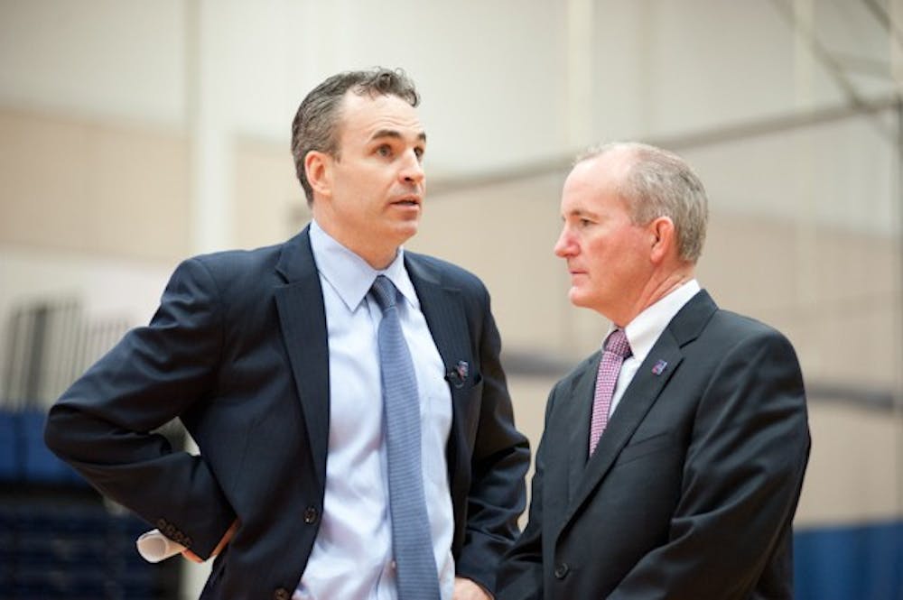 AU men\'s basketball Head Coach Mike Brennan (left) and Athletic Director Billy Walker. 