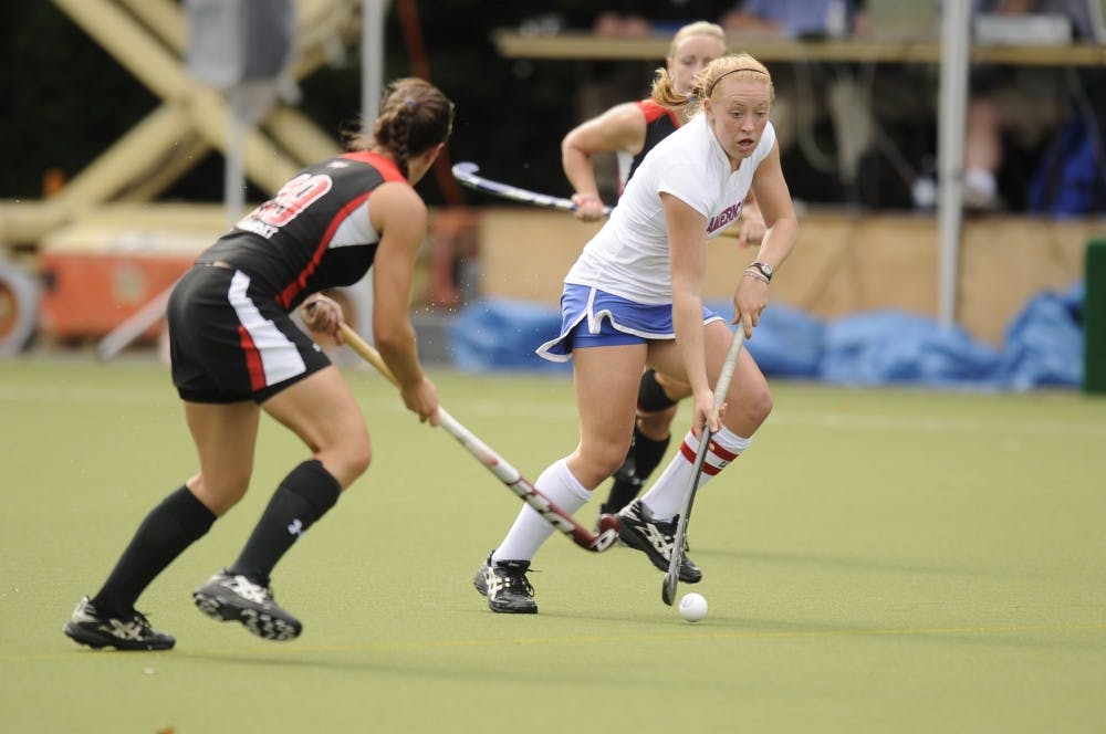 	Graybill (right) competes in a field hockey game during her time at AU.