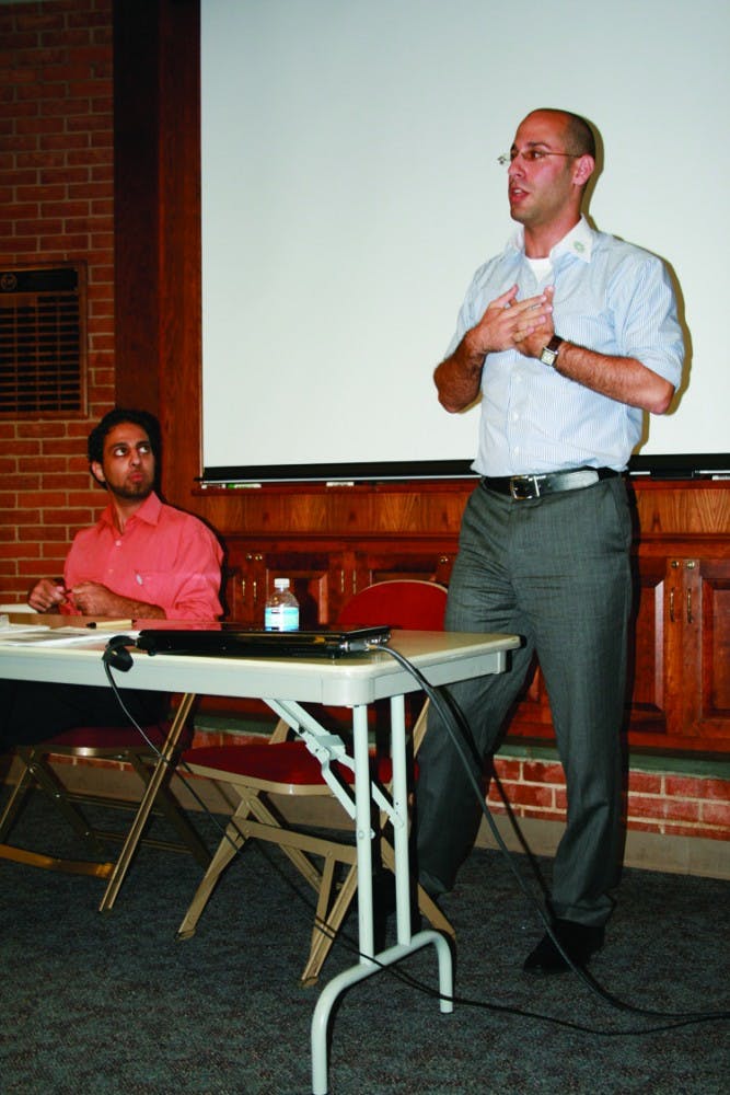 TWO SIDES, ONE VOICE â€“ Danny Shaket, right, speaks about his work with OneVoice, a nonprofit organization which strives for an end to the Israeli-Palestinian conflict. Ahmad Omeir, left, said he joined OneVoice because of a friendâ€™s death in 2003.