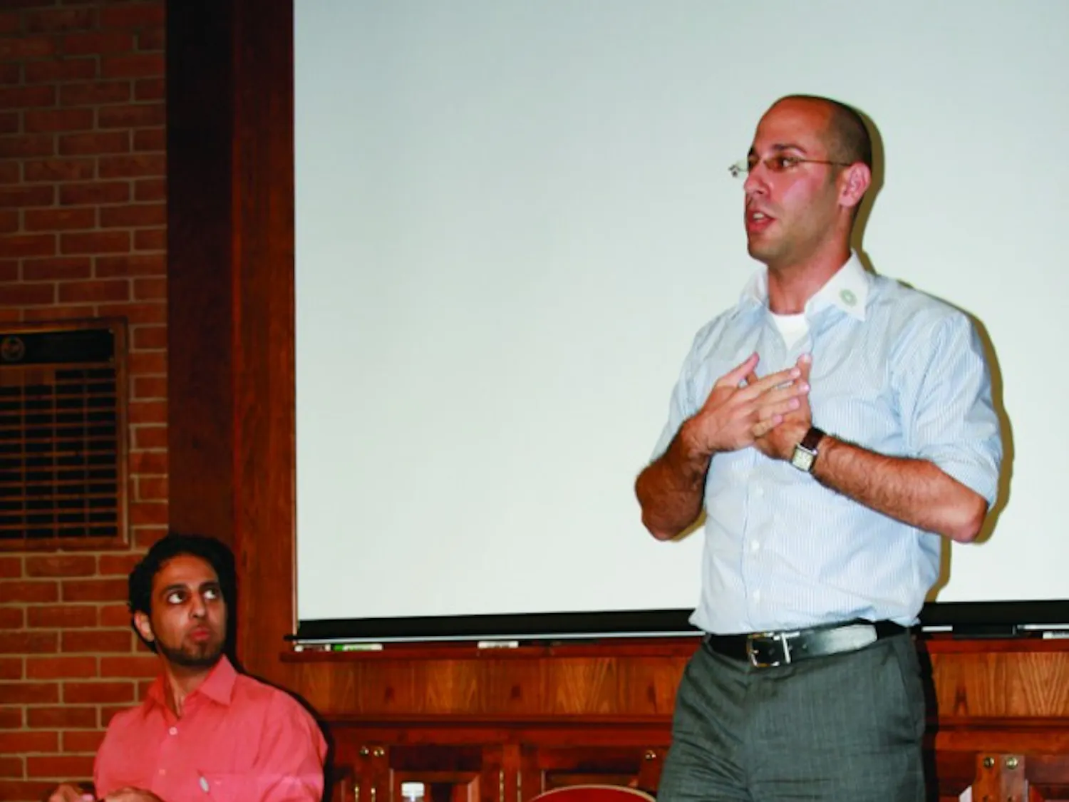 TWO SIDES, ONE VOICE – Danny Shaket, right, speaks about his work with OneVoice, a nonprofit organization which strives for an end to the Israeli-Palestinian conflict. Ahmad Omeir, left, said he joined OneVoice because of a friend’s death in 2003.