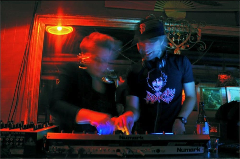 	Verdult (left) and Alzayat (right) spin tracks at Jimmy Valentine’s. 
