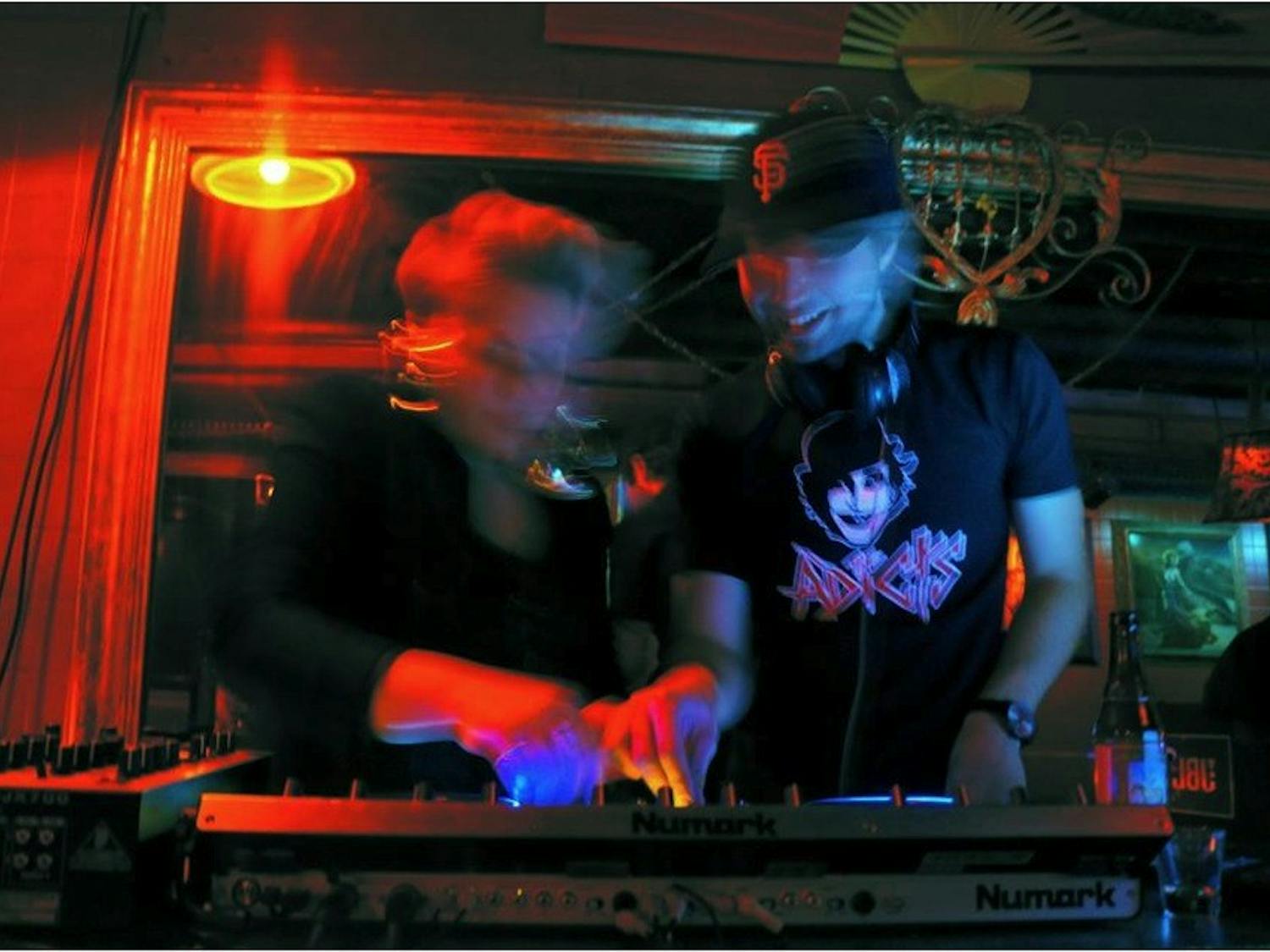 	Verdult (left) and Alzayat (right) spin tracks at Jimmy Valentine’s. 