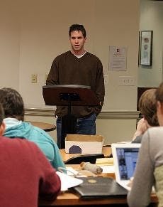 SAVING SUB - Shea Mulcahy, director of the Student Union Board, stands up to speak with regards to the possible cuts to SUB's budget next year at the meeting Sunday afternoon.