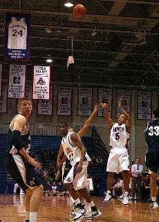 TRIFECTA- AU's Garrison Carr launches one of his trademark three-pointers last night in the game against Navy. However, it was not enough to prevent the Eagles' second straight home loss.