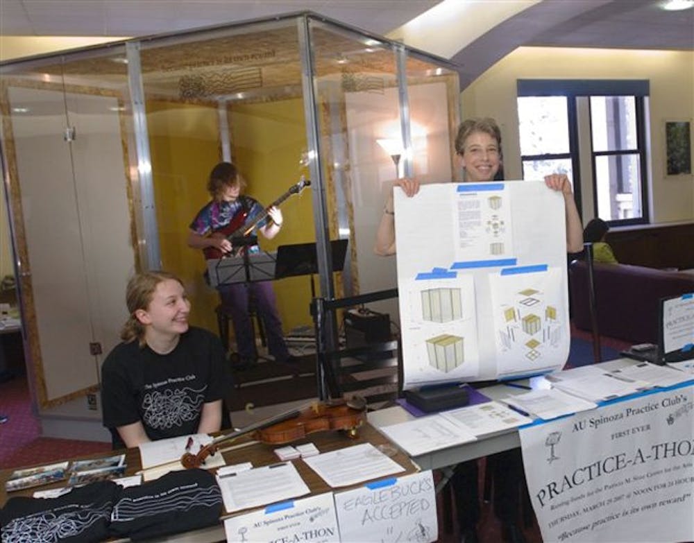 D07_454_Practice_a_ThonMusic Department Chair Nancy Snider (right) and Thais Miller (CAS 2010) work the table raising funds for the Sitar  Center
