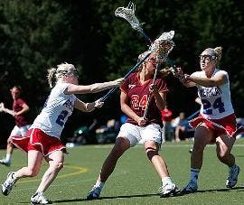 TEAMING UP- No. 24 senior defender Whitney Kovar teams up with a fellow Eagle to harass a Virginia Tech Hokie opponent during the game on Saturday afternoon.  The Eagles lost to the Hokies 19-11 despite a four goal effort by freshman Lauren Schoenberger, 