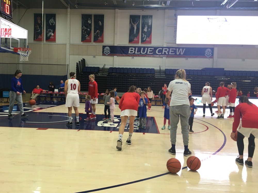 Members of the AU women's basketball team participating in&nbsp;National Girls and Women in Sports Day after their overtime victory over Army West Point Saturday.