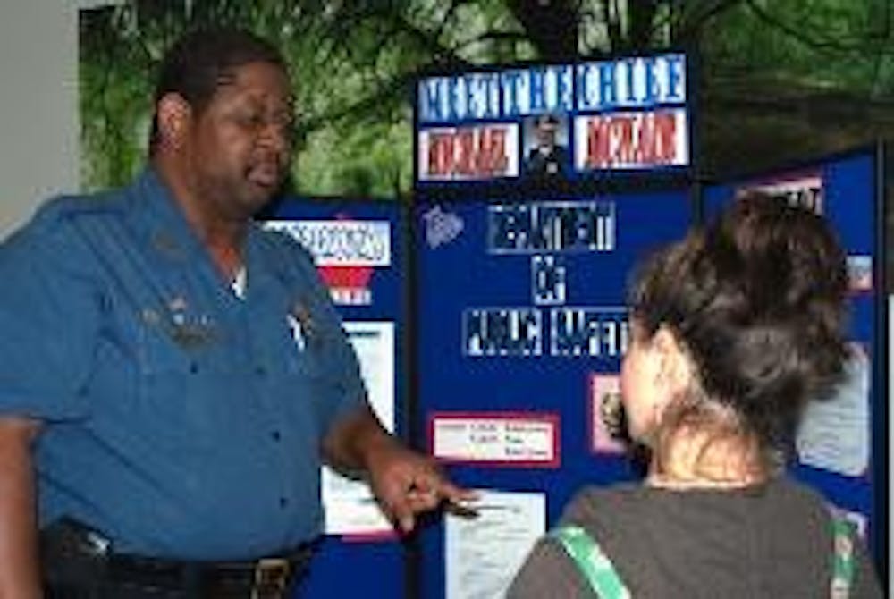 STAY ALERT - Michael McNair, chief of Public Safety, talks with Courtney Rigas, a sophomore in the School of International Service, about what to do in case of an emergency.