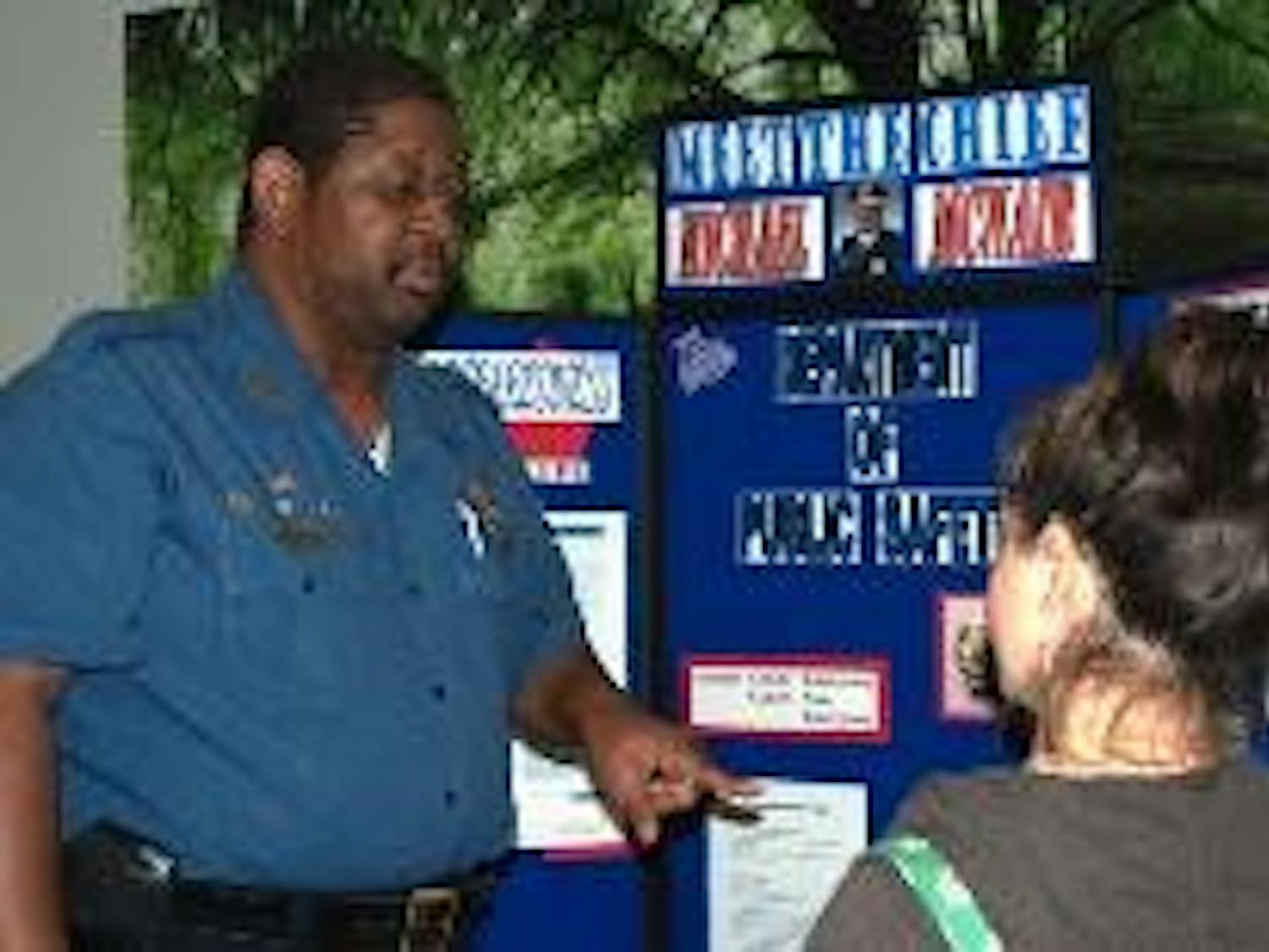 STAY ALERT - Michael McNair, chief of Public Safety, talks with Courtney Rigas, a sophomore in the School of International Service, about what to do in case of an emergency.