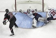 SPRAWLING - Washington Capitals goaltender Jose Theodore makes a diving save in a recent game against the Ottawa Senators.  The Capitals have been struggling recently, having only won five of their last 12.