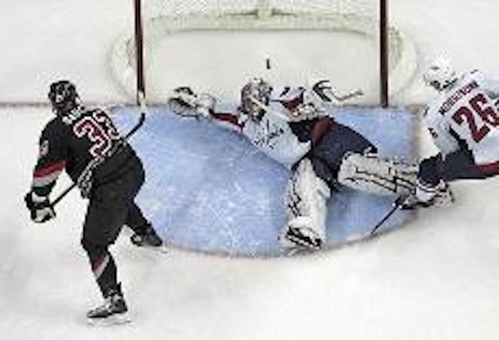 SPRAWLING - Washington Capitals goaltender Jose Theodore makes a diving save in a recent game against the Ottawa Senators.  The Capitals have been struggling recently, having only won five of their last 12.