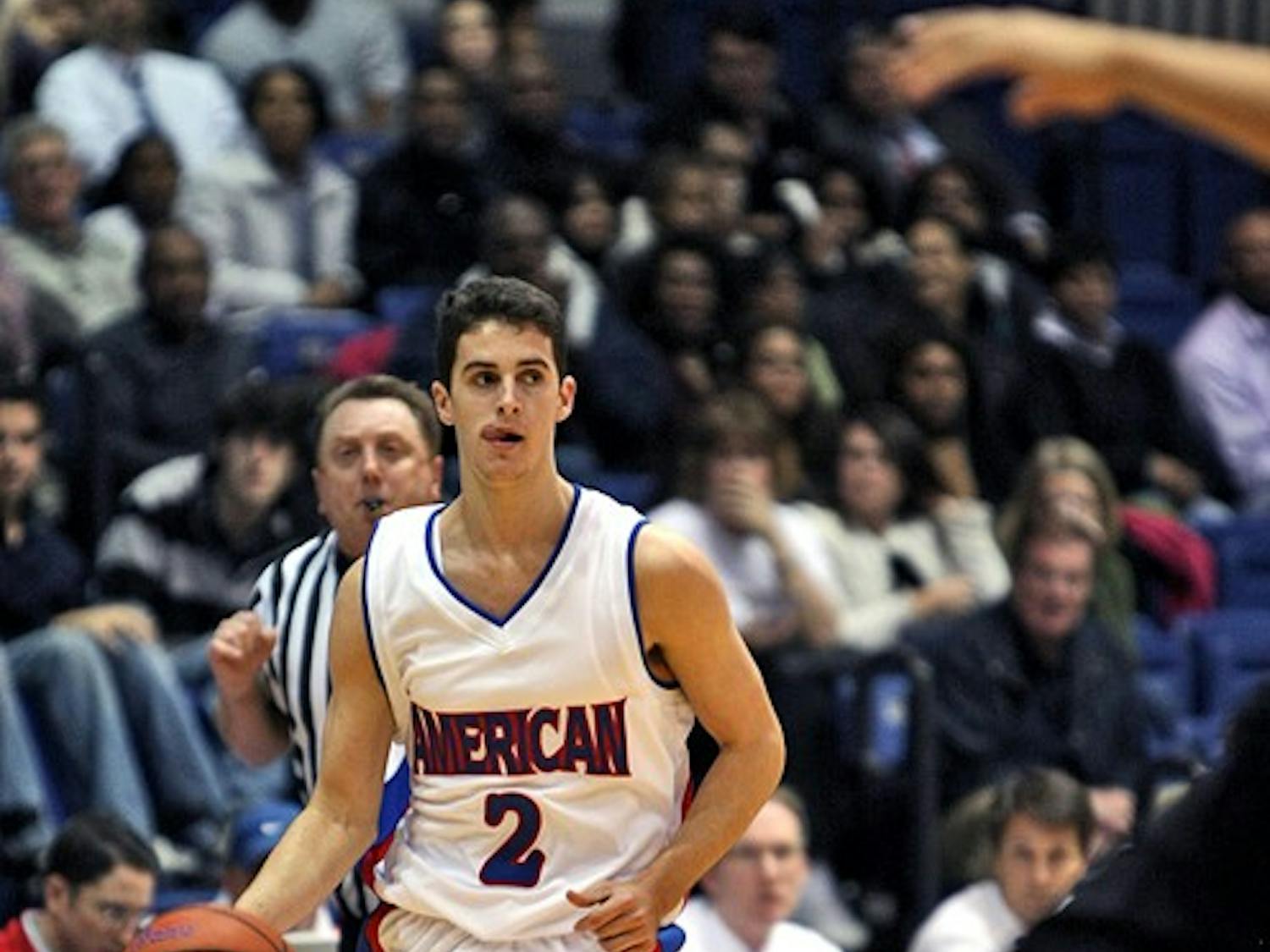 LESS THAN STELLAR— Freshman Daniel Munoz takes the ball up the court in a game this year. AU blew an 11-point halftime lead and went on to lose 65-61. This year’s squad is much differnet than the one that won two straight PL Championships. AU lost its three star players to graduation.