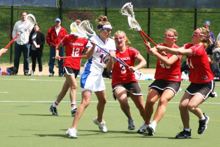 WILD IN-Sophomore midfielder Emily Burton helps the Eagles cradle to victory in an overwhelming win against the Davidson Wildcats.  Six different Eagles scored goals,  as well as a five goal career high for sophomore midfielder Samantha Marshall. 