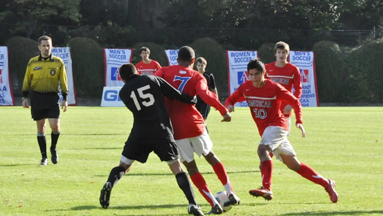 Fighting for Control — Jack Scott (7) and Cristobal Soto (10) try to get the ball from a Holy Cross player. The match ended 0-0 as the Eagles were unable to capitalize on any scoring chances.