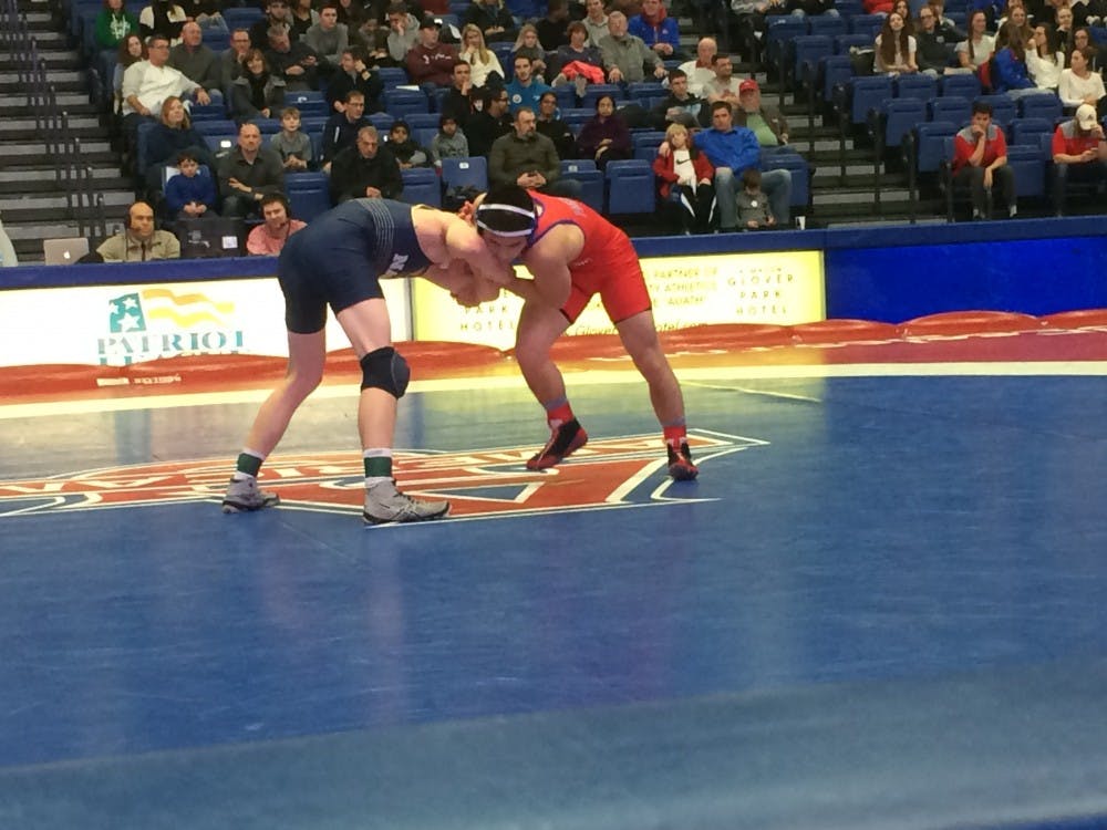 Redshirt junior Josh Terao locks up his opponent in a 133-pound bout on Jan. 19.&nbsp;