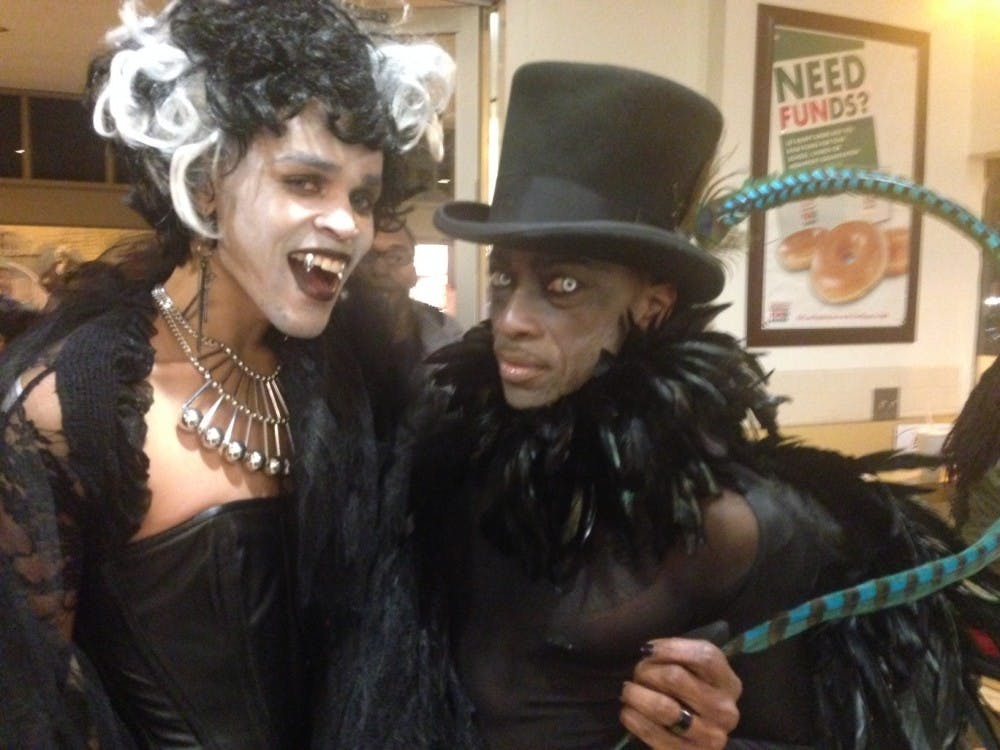 	Two drag queens pose for a photo at the annual “High Heel Drag Race” on Oct. 29.