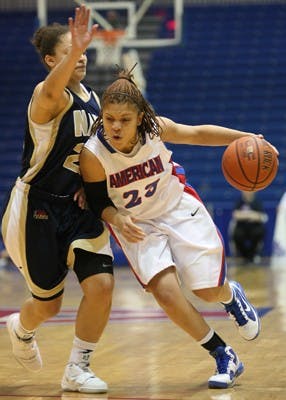 PUSHING FORWARD â€” AU junior Raven Harris pushes past a Navy defender during their 66-38 win last night. Michelle Kirk and Liz Leer carried the team and accounted for 53 percent of the Eaglesâ€™ offense.