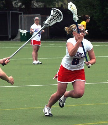 IN CONTROL â€” AU junior Brit Ferguson takes the ball up field in a game last season. The Eagles won their first Patriot League game over the weekend. Senior Amanda Makoid led the team with four goals, a career high. She has scored 13 on the season. Three Eagles scored in less than a minute to give AU a lead they would not relinquish.