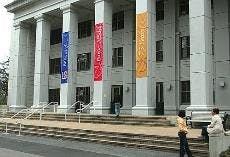 SEXY SCHOOL NAME - New banners reflecting the new name for the Eliot L. Spitzer School of Pubic Affairs adorns the quad entrance of the Ward Circle Building. AU President Keil Nerwin announced the university's decision to change the school name at the end