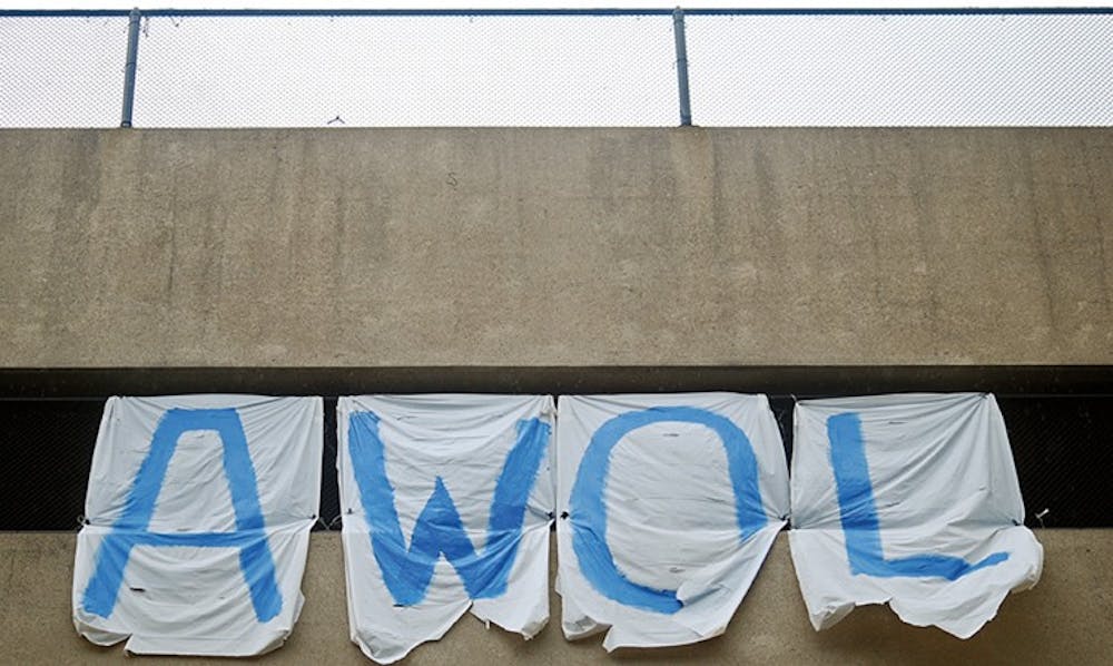 FLAG DOWN â€” AUâ€™s American Way of Life magazine hung an upside-down flag from the Bender parking garage last week to signal that the nation is in â€œdire distress.â€ The flag was taken down twice and tampered with. AWOL is a biannual, left-wing publication.
