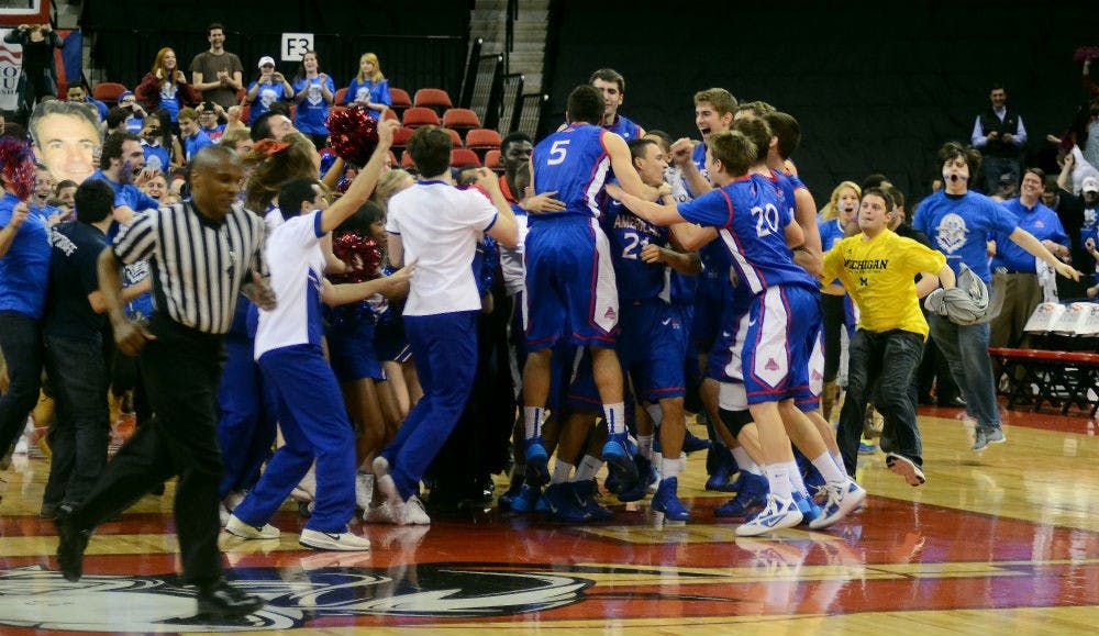 	AU fans and basketball players celebrate the team&#8217;s victory against Boston University on March 12.