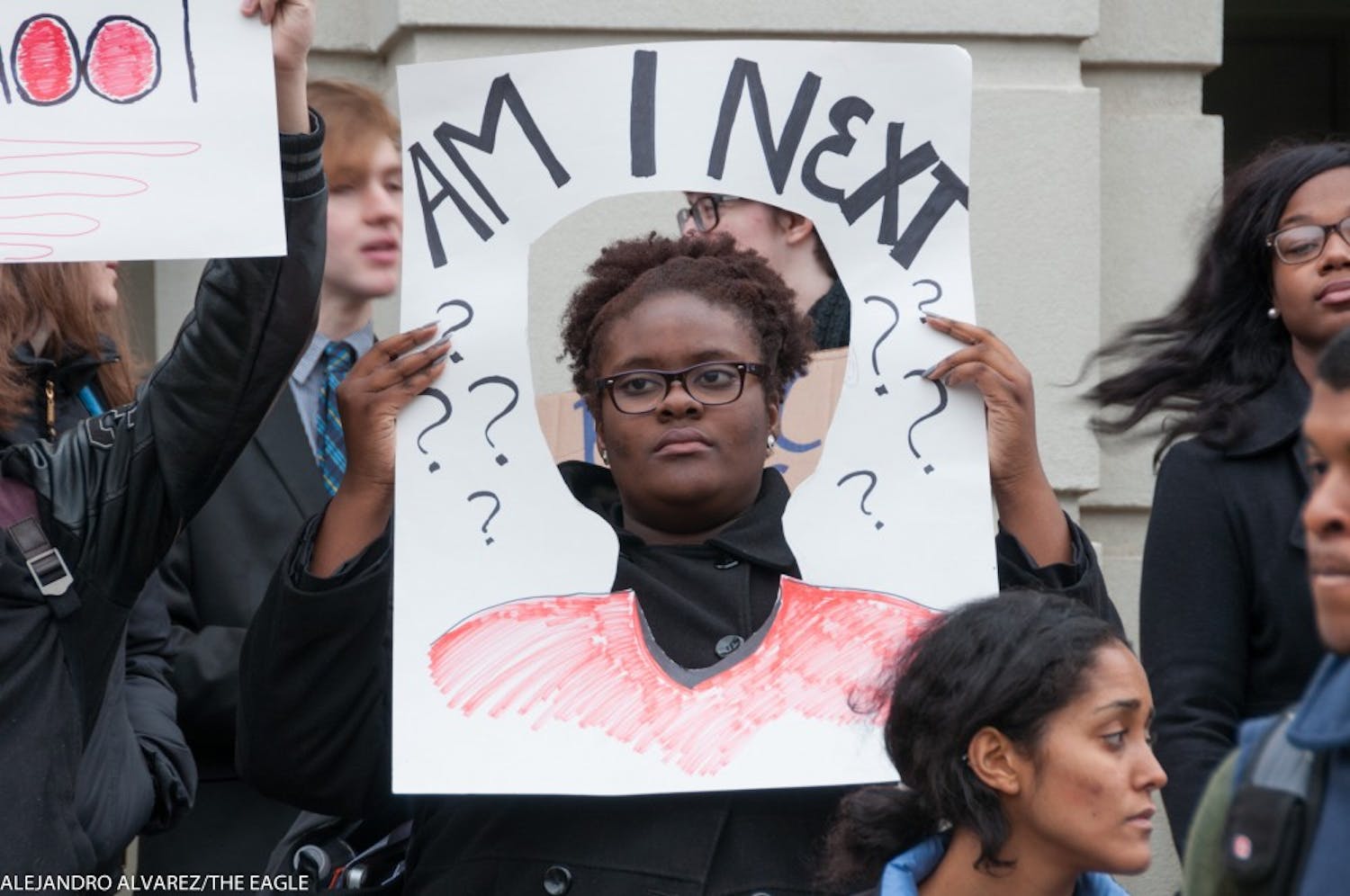 Photo: A student demonstrates at "The Darkening,"  an Dec. 3 movement in solidarity with the national "Black Lives Matter" movement.