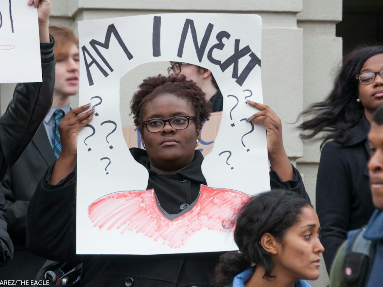 Photo: A student demonstrates at "The Darkening,"  an Dec. 3 movement in solidarity with the national "Black Lives Matter" movement.