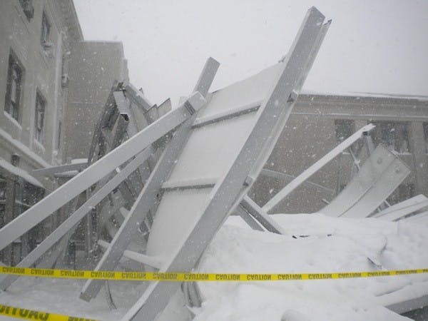 UNDER PRESSURE â€” The recently-built canopy between Mary Graydon Center and the Battelle-Tompkins building collapsed Wednesday under the weight of last weekâ€™s two snowstorms. No injuries were reported.