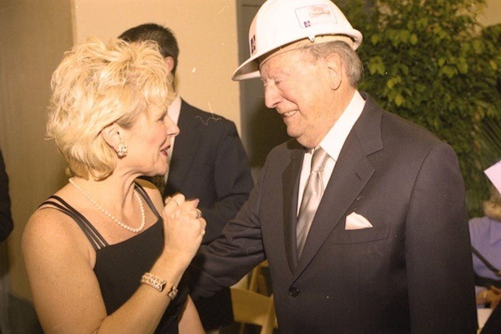 Harold Greenberg (right), speaks to AU professor Gail Humphries Mardirosian, who directed \"Cabaret\" this year in honor of the Greenberg Theatre\'s 10th anniversary. 