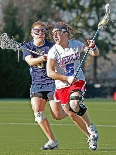 EAGLES FALL AGAIN - In this file photo, senior Leslie Fischer races up the field against George Washington University. She was the star player of American's 16-12 loss to their Patriot League rivals Holy Cross. Fischer scored a team high three goals on th