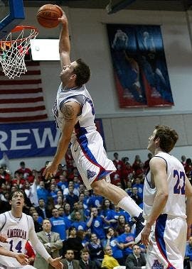 SLAMMING HOME - Sophomore guard Nick Hendra rises up to dunk the ball in Saturday's win against the Colgate University Raiders. Hendra scored 16 points and grabbed 11 rebounds for his first career double-double.