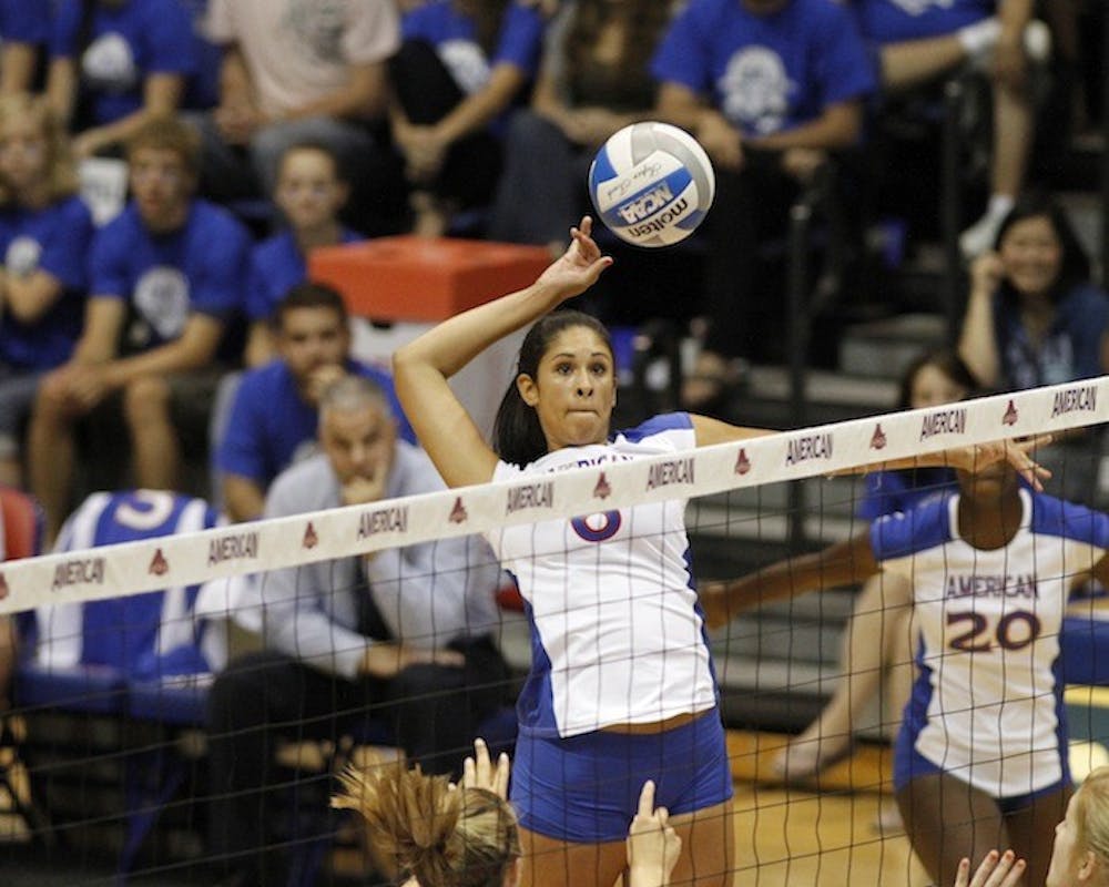 Sophomore middle blocker Bianca Richardson reaches for the ball during AU\'s 25-18, 25-22, 25-23 victory over the George Mason Patriots Friday night.