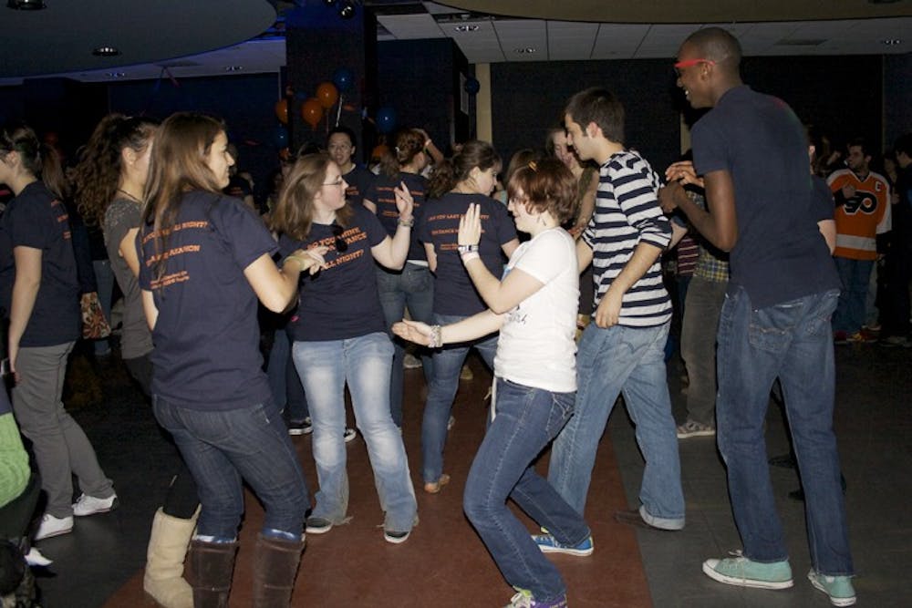 DANCING THE NIGHT AWAY â€”  AU students jump and jive during the Dance Marathon on Jan. 28. This yearâ€™s event raised funds for the Elizabeth Glaser Pediatric AIDS Foundation.