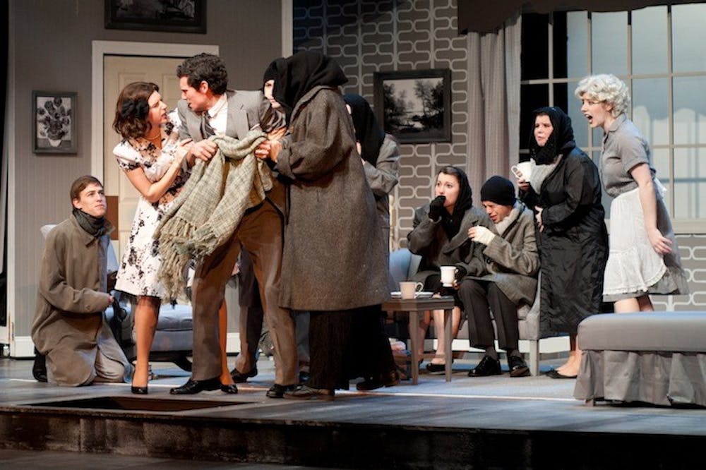 Kendall Helblig (left) and Matthew Ingraham (center) fight during a scene in â€œThe Skin of Our Teeth.â€ The sinister take on Thornton Wilderâ€™s play is directed by AU theater professor Carl Menninger.