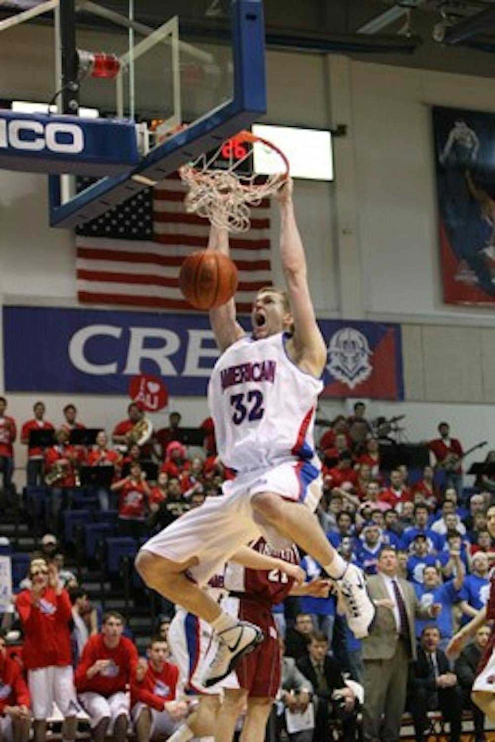 BRINGING IT HOME â€” Stephen Lumpkins nets a two-handed slam dunk in the Eagles 78-60 win on Saturday in Bender Arena.