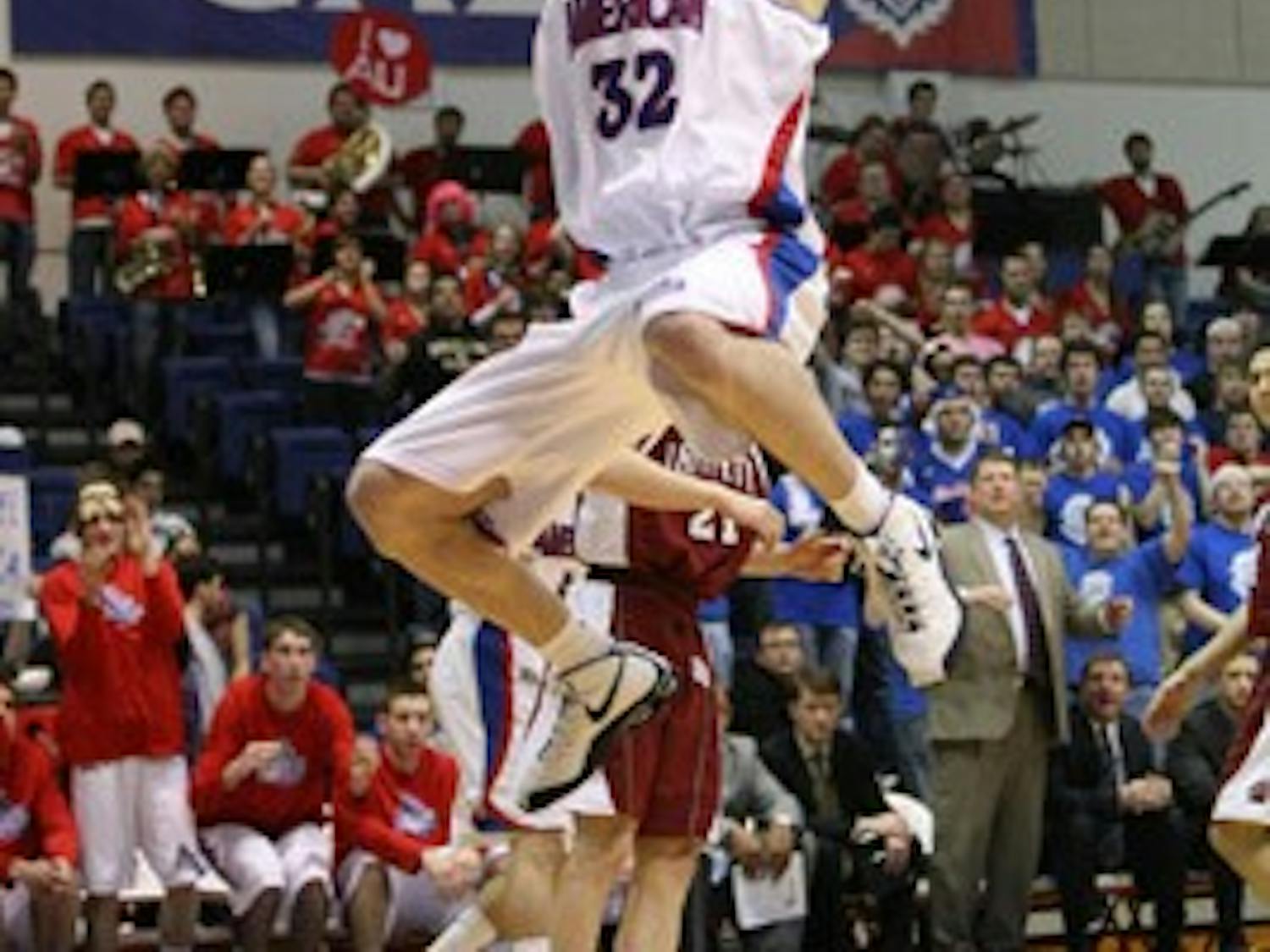 BRINGING IT HOME — Stephen Lumpkins nets a two-handed slam dunk in the Eagles 78-60 win on Saturday in Bender Arena.