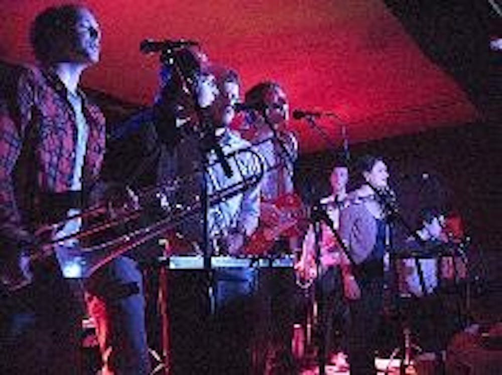 LUCKY SEVEN - Anathallo serenades fans with "Dokkoisse House," a song adapted from a Japanese fable, at the Rock and Roll Hotel Sunday night.  The band delivered its choral arrangements and orchestral compositions with theatrical choreography and youthful