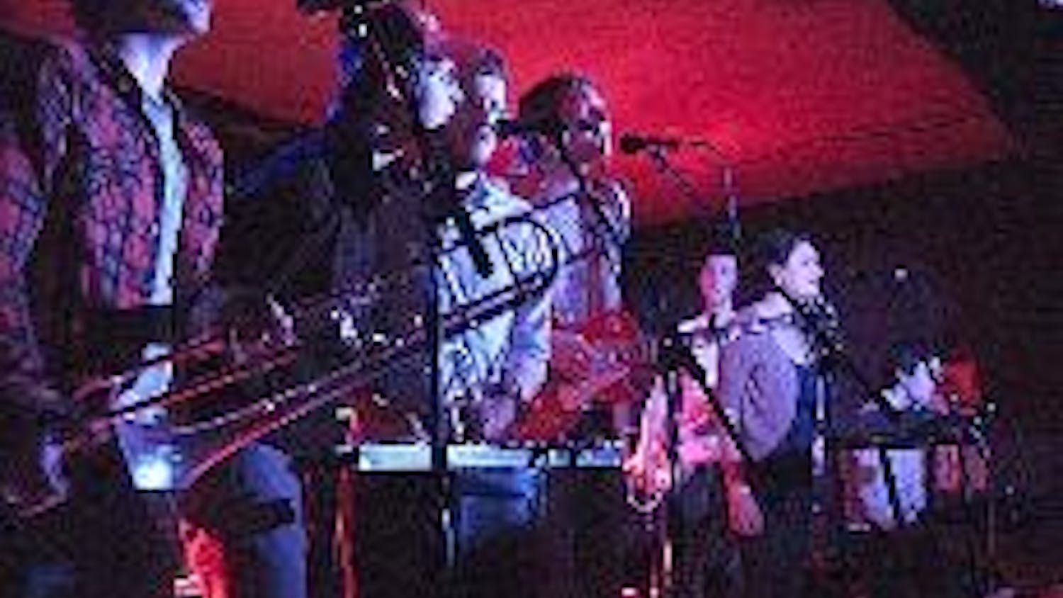 LUCKY SEVEN - Anathallo serenades fans with "Dokkoisse House," a song adapted from a Japanese fable, at the Rock and Roll Hotel Sunday night. The band delivered its choral arrangements and orchestral compositions with theatrical choreography and youthful