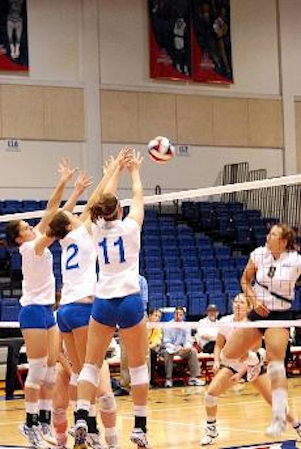 TRIPLE THREAT - Rubena Sukaj, Katarina Cinkova and Christina Nash (from left to right) all put up their arms  to block a shot in the Eagles' recent match against the U.S. Naval Academy.  AU won 3-2 on Saturday.