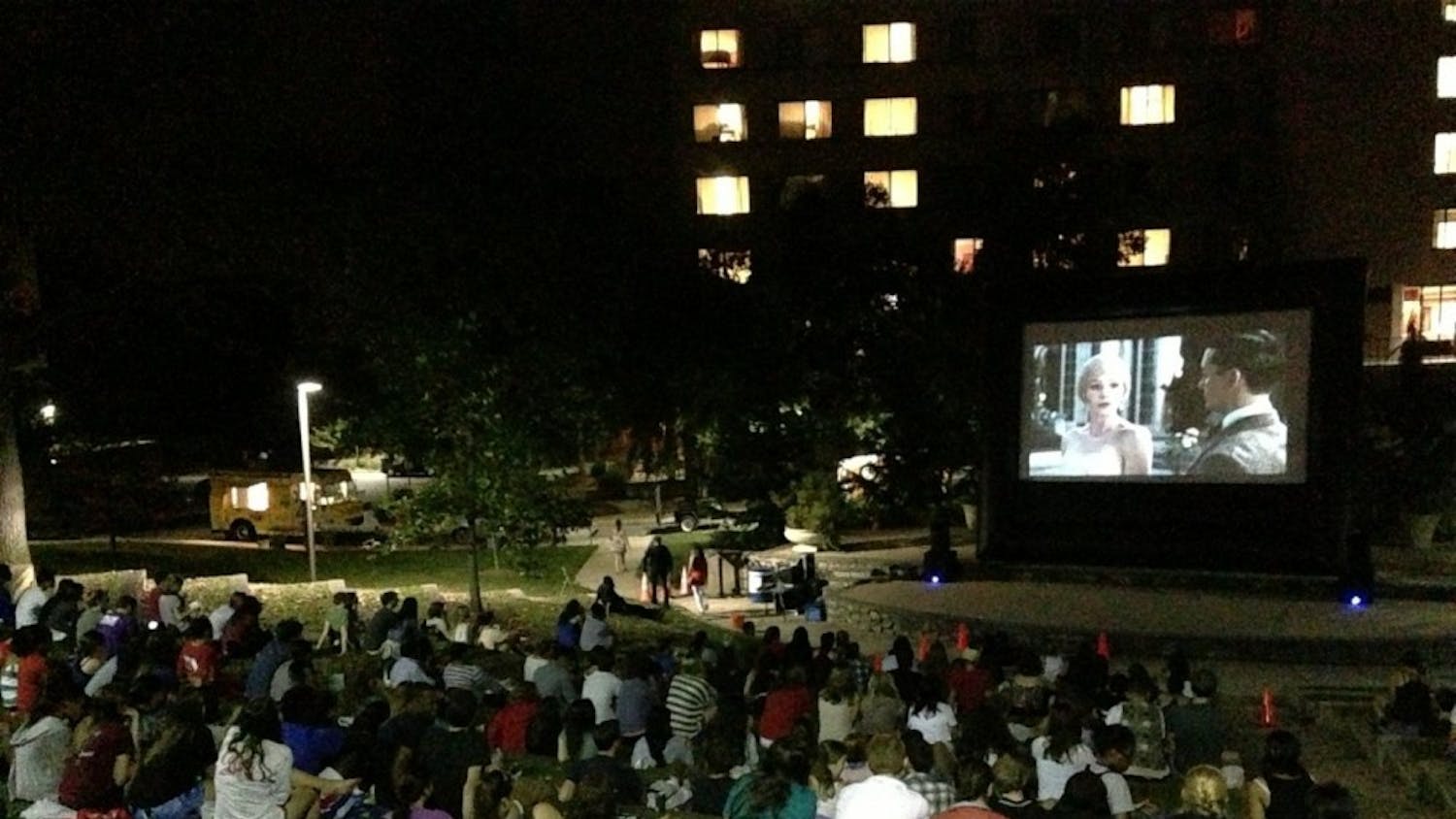 	Students munch on popcorn and candy in the amphitheater while watching &#8220;The Great Gatsby&#8221; on Aug. 22.