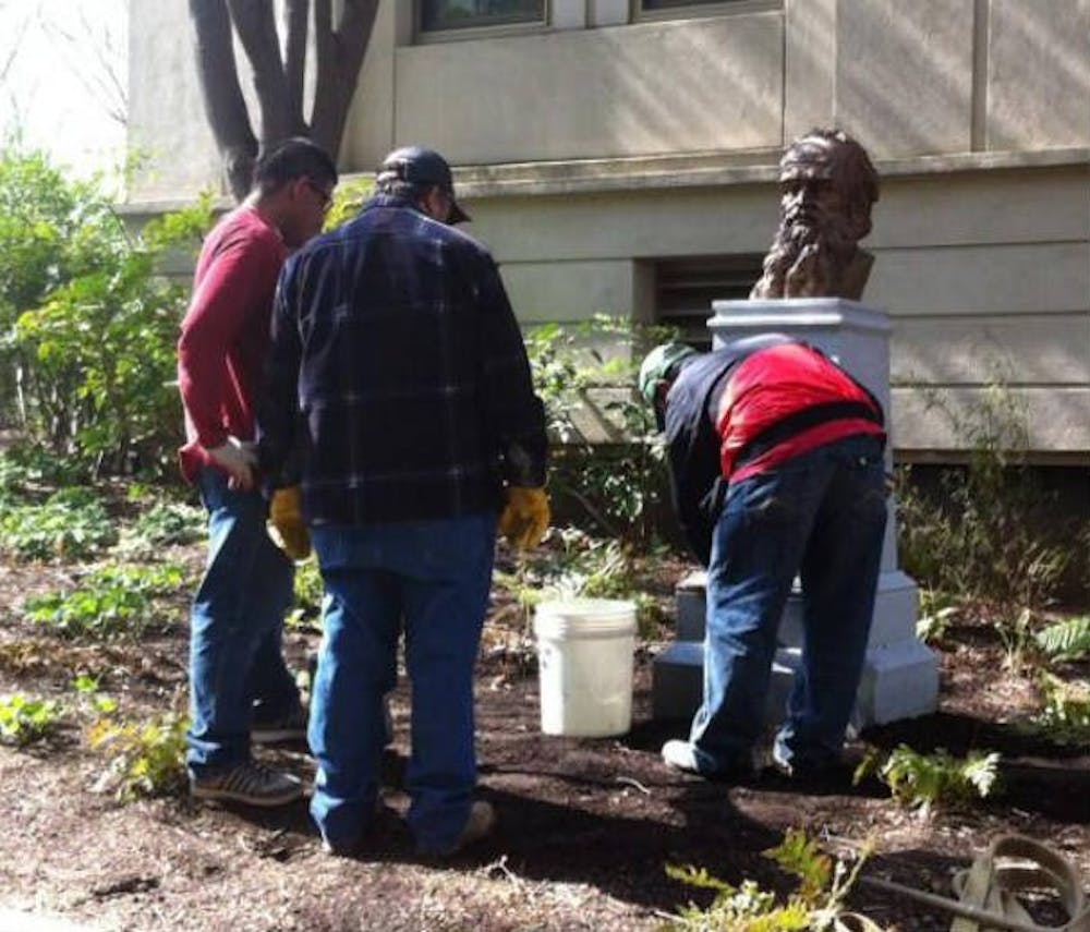 Grounds workers briefly put the new Leo Tolstoy bust on display outside of Battelle-Tompkins April 12.