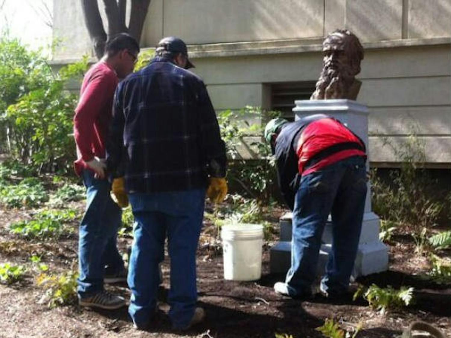 Grounds workers briefly put the new Leo Tolstoy bust on display outside of Battelle-Tompkins April 12.