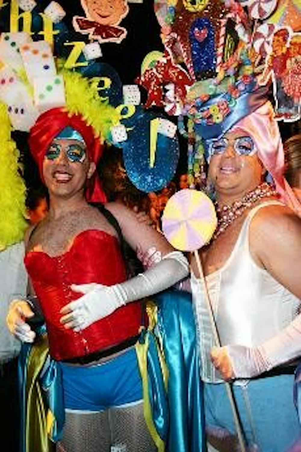 A contestant races toward the finish line and another contestant dresses up as the Washington Monument during the annual High Heel Drag Race. The race, in its 22nd year, is held in Dupont Circle on 17th Street between P and S streets. The race raises mone